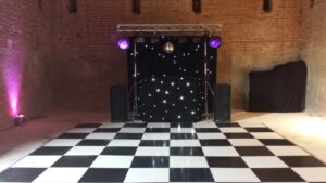 Black Gold Rig with mirrorball, Starcloth backdrop and uplighters (daylight)