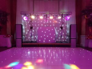 Gold Rig (white) with mirrorball, Starcloth backdrop, "Starlit" dance floor and purple uplighters